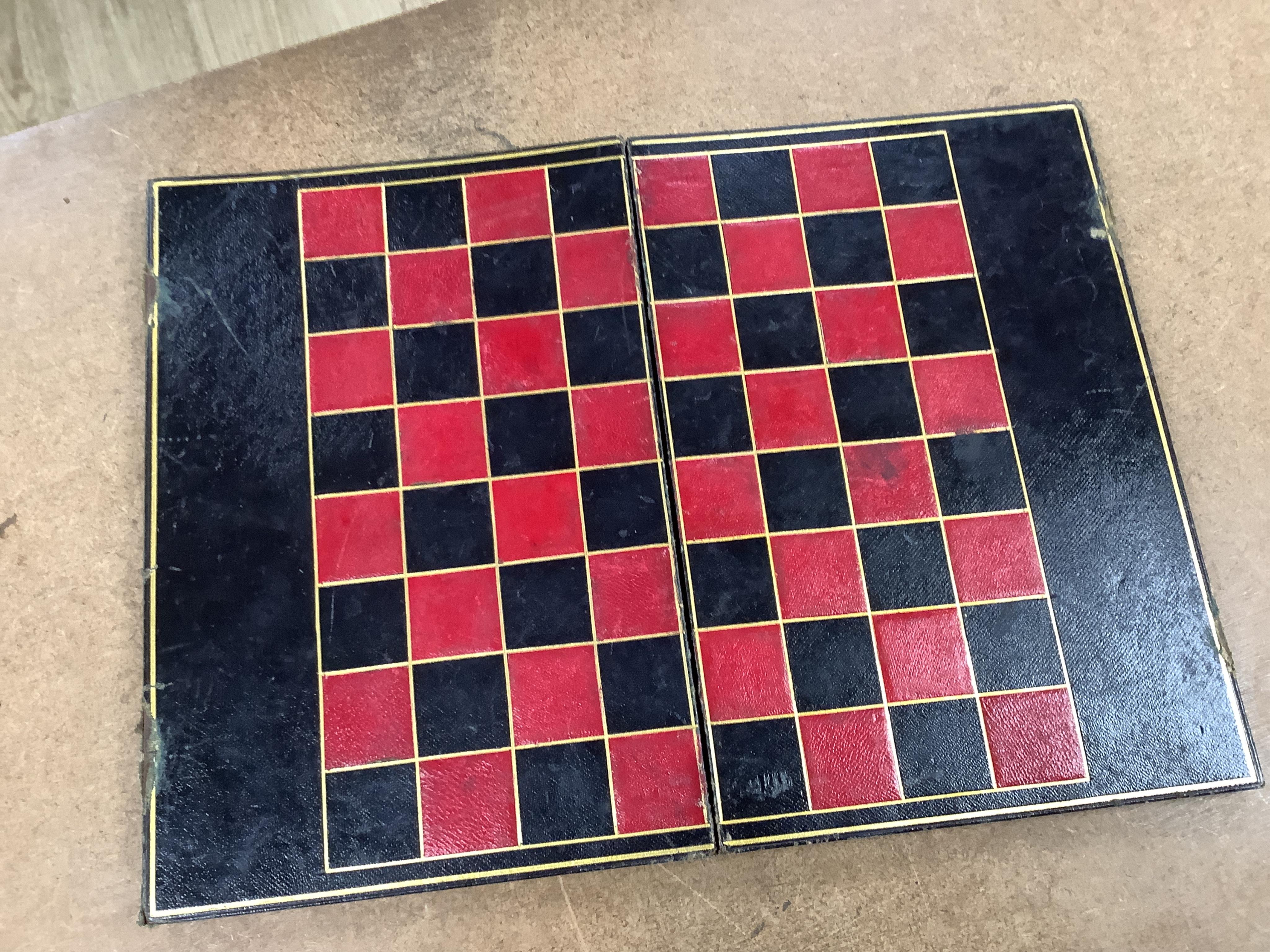 A Victorian coromandel games box with accessories, ivory chess pieces and counters, box 36cm wide x 19cm high. Condition - red interior leather worn and torn in places and box scratched, minor losses to chess pieces. CIT